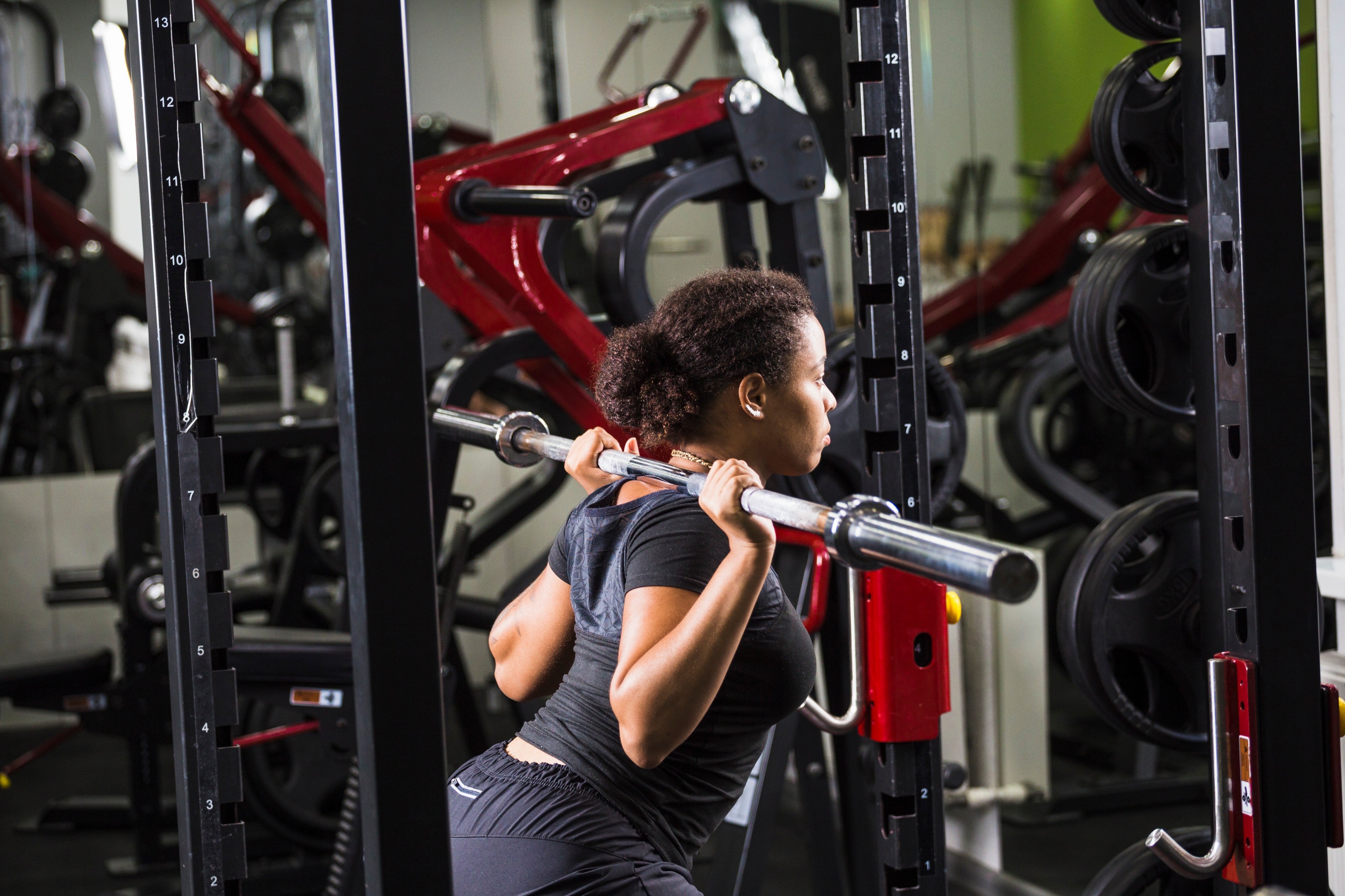The Role of Squat Racks and Smith Machines in Sports Training